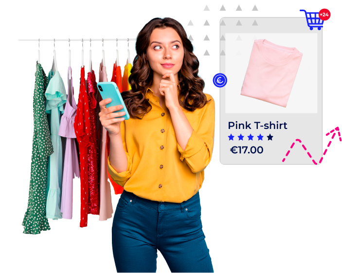 woman looking at a pink t-shirt while having some clothes behind her
